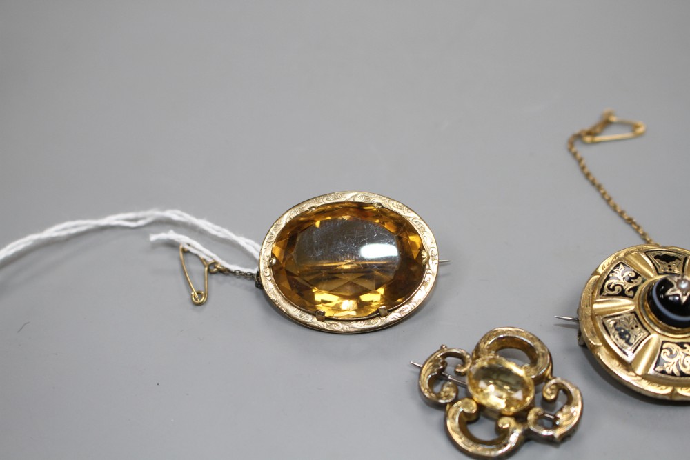 A Victorian yellow metal, enamel, banded agate and seed pearl set mourning brooch and three other brooches,